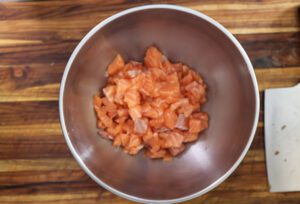 diced salmon pieces in a bowl