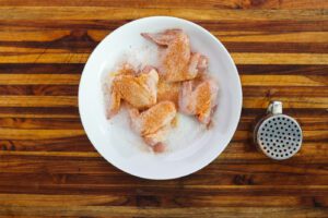 seasoned chicken wings on white plate