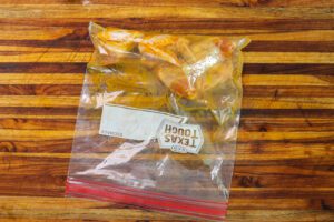 chicken wings marinating in plastic bag