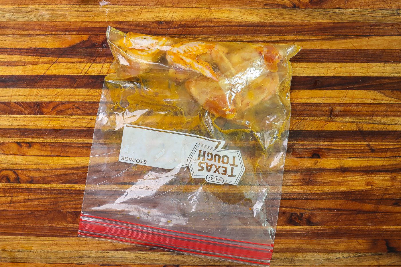 chicken wings marinating in plastic bag