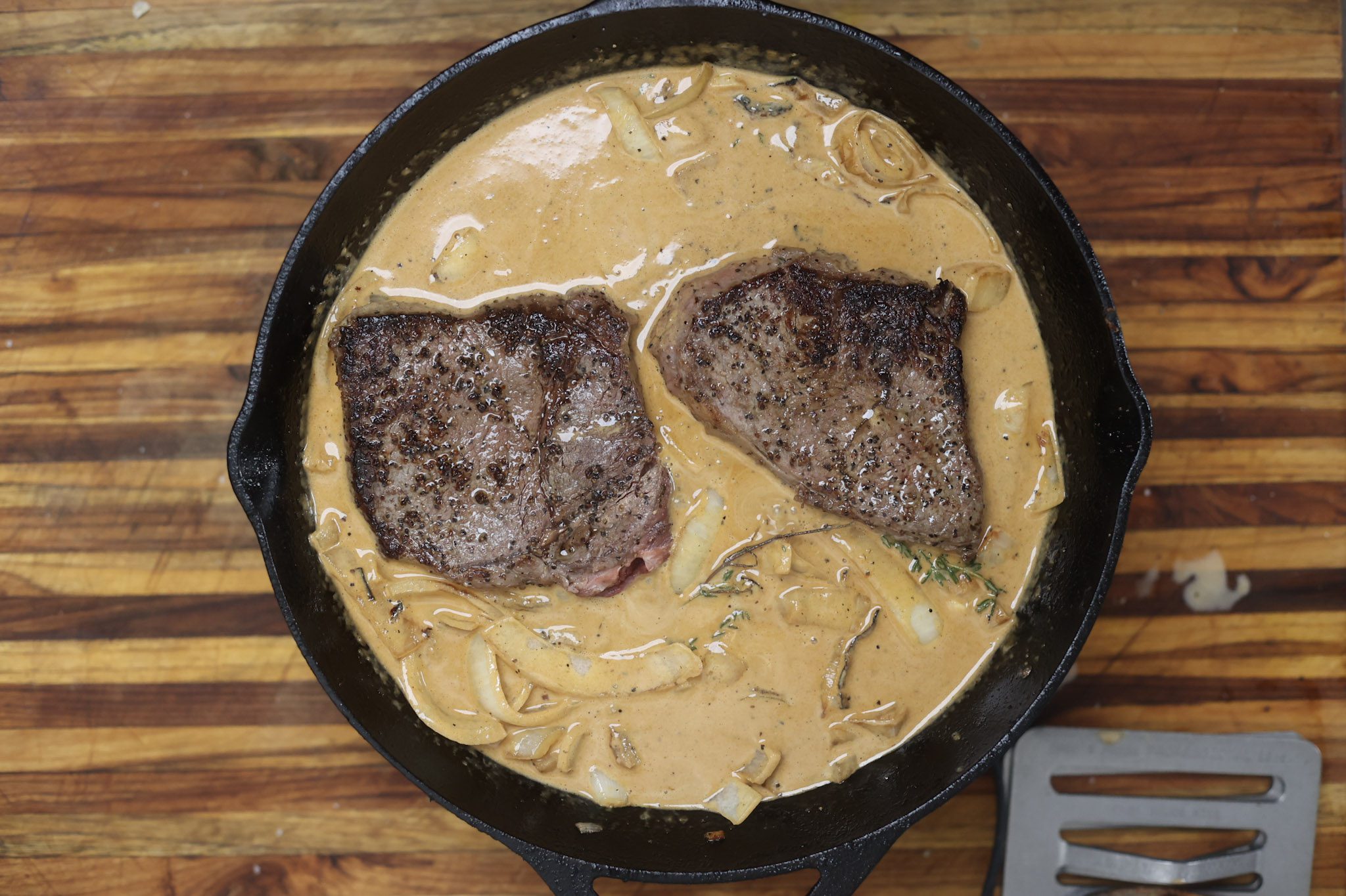 steak simmering in gravy