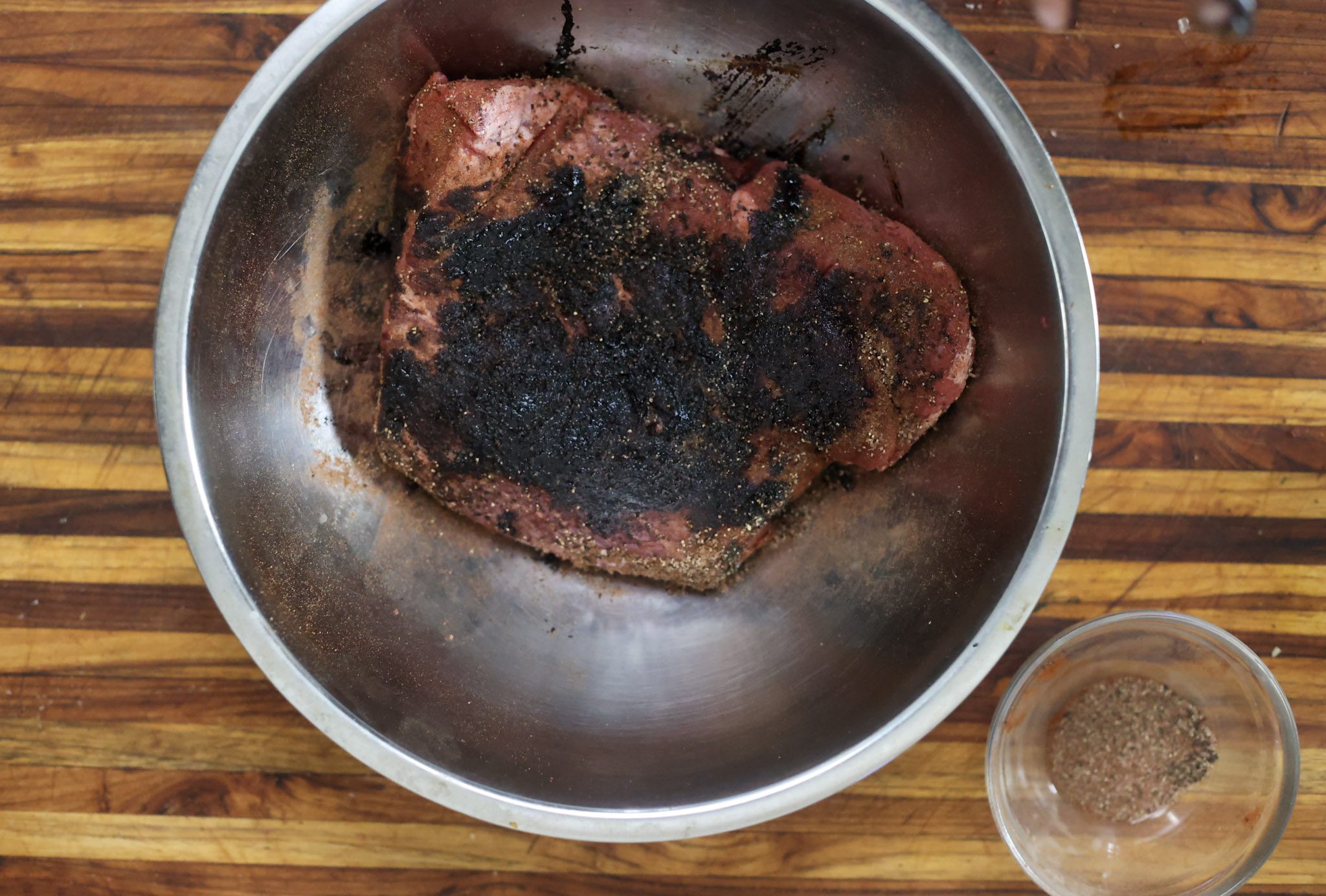 seasoned brisket in silver bowl