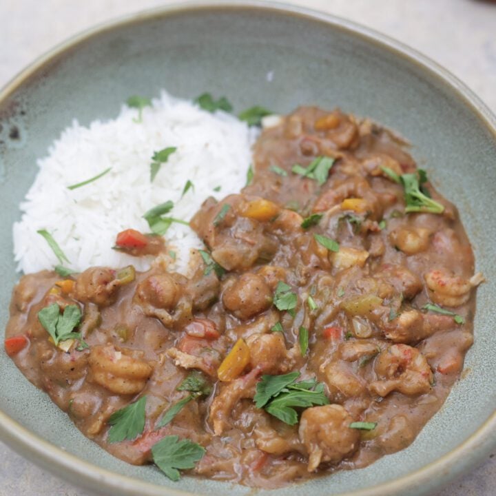 crawfish etouffee and rice in green bowl