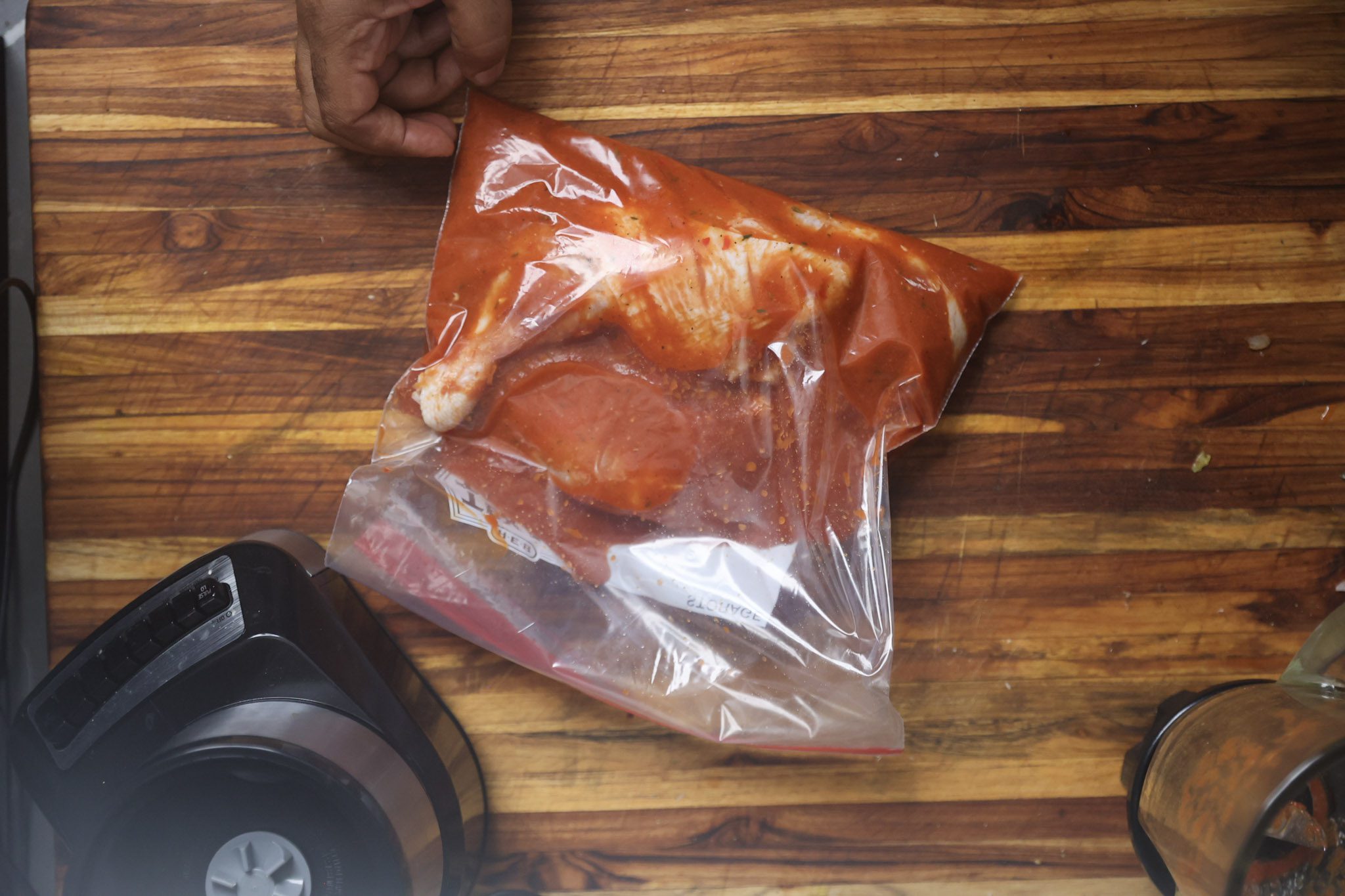 chicken marinating in ziplock bag