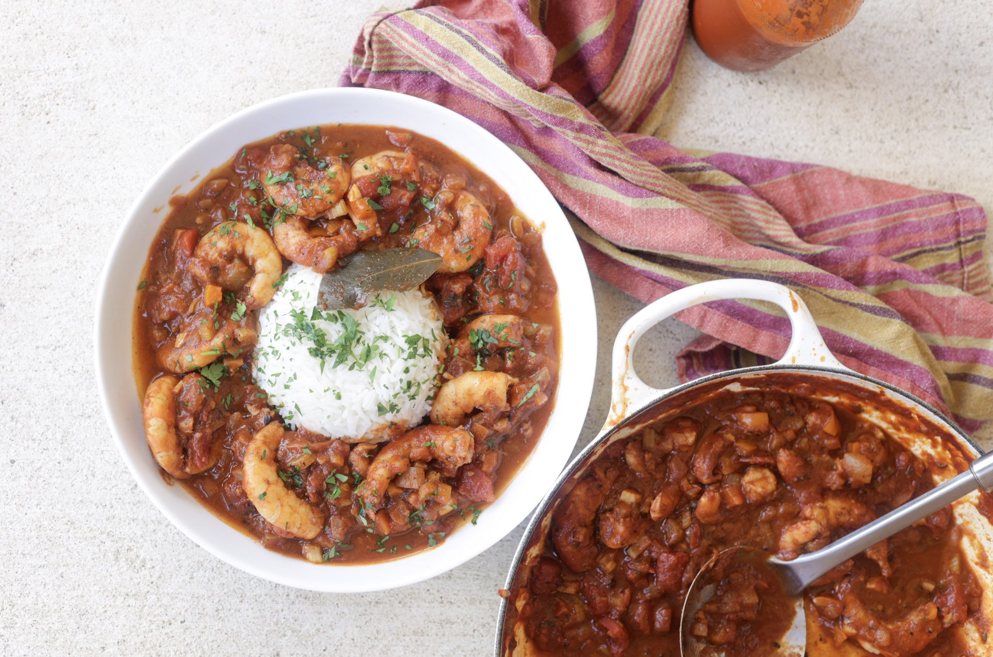 shrimp creole with rice in a white bowl