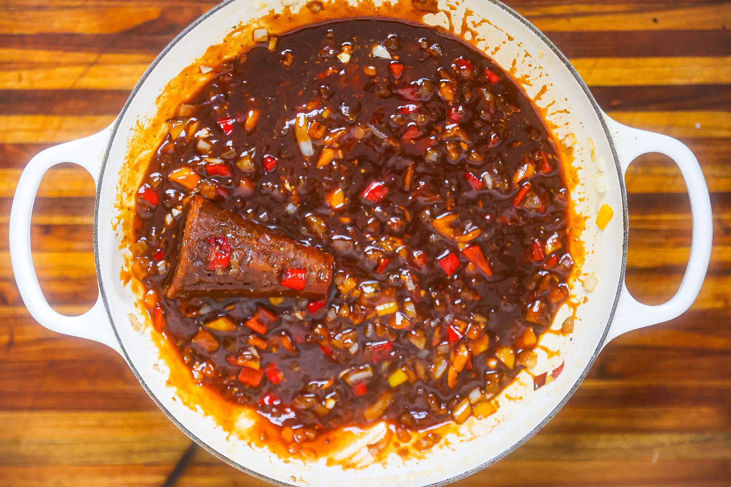 sauce and beans sauteing in pan