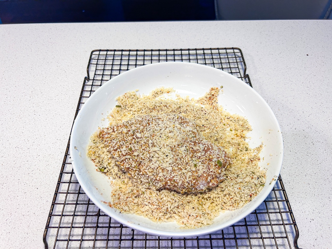 chicken breast coated in bread crumbs