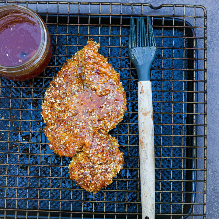 oven fried chicken breasts on wire rack lined baking sheet