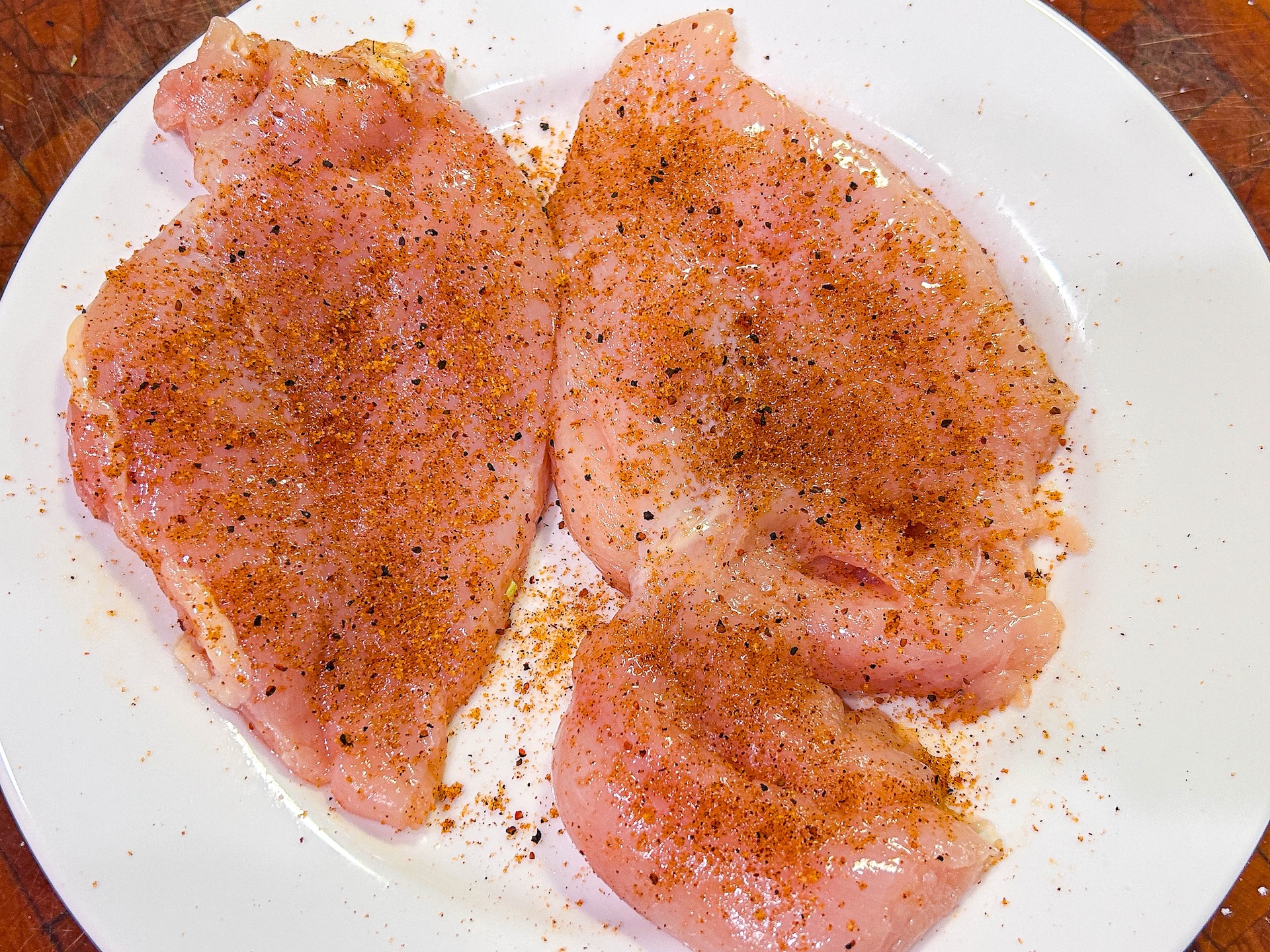 seasoned chicken breasts on white plate